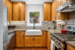 Warm, updated kitchen with stainless steel appliances